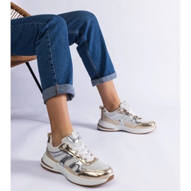 Materiałowe sneakersy sportowe ze złotymi wstawkami 1